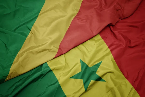 Waving colorful flag of senegal and national flag of republic of the congo. — Stock Photo, Image