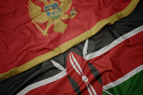 ケニアのカラフルな旗とモンテネグロの国旗を振って. — ストック写真