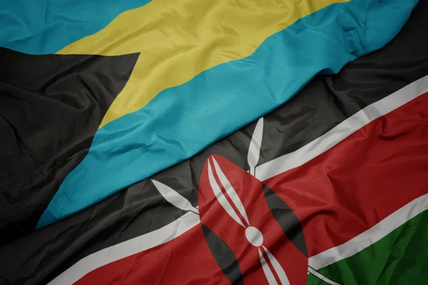 Viftande färgglada flagga kenya och nationell flagga bahamas. — Stockfoto