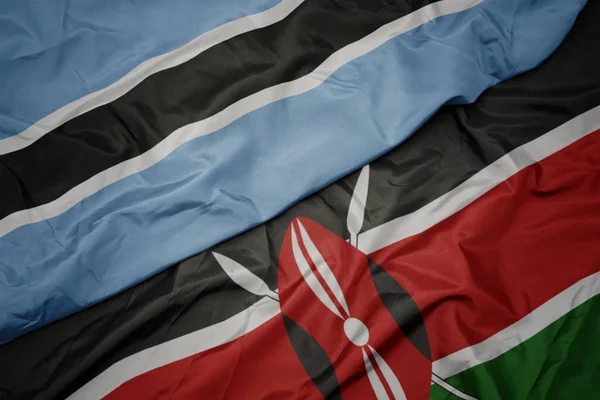 Viftande färgglada flagga kenya och nationell flagga botswana. — Stockfoto