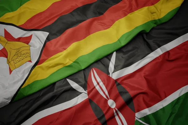 Waving colorful flag of kenya and national flag of zimbabwe. — Stock Photo, Image