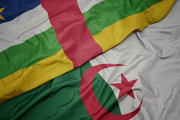Waving colorful flag of algeria and national flag of central african republic. — ストック写真