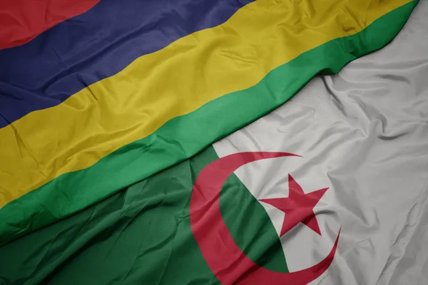 Waving colorful flag of algeria and national flag of mauritius. — ストック写真