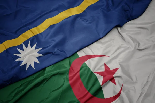 Schwenken bunte Flagge von Algerien und Nationalflagge von Nauru . — Stockfoto