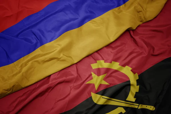 Angola 'nın renkli bayrağı ve Ermenistan' ın ulusal bayrağı sallanıyor.. — Stok fotoğraf