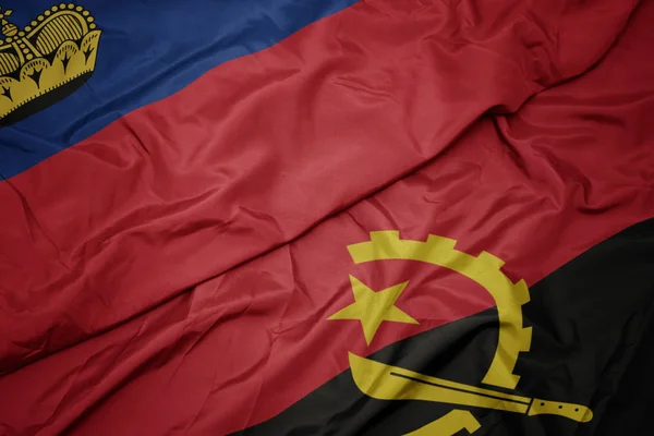 Machanie kolorowa flaga angoli i flaga narodowa liechtenstein. — Zdjęcie stockowe