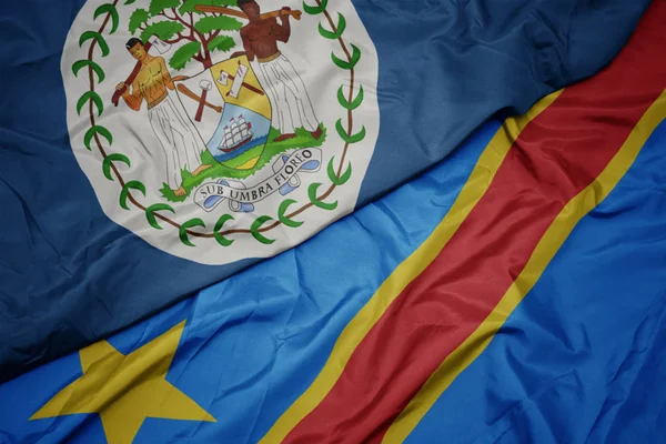 Viftande färgglada flagga demokratisk republik congo och nationell flagga belize. — Stockfoto