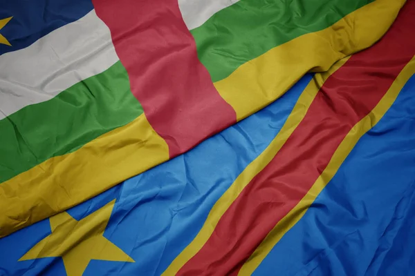 Acenando bandeira colorida da República Democrática do Congo e bandeira nacional da República Centro-Africana . — Fotografia de Stock