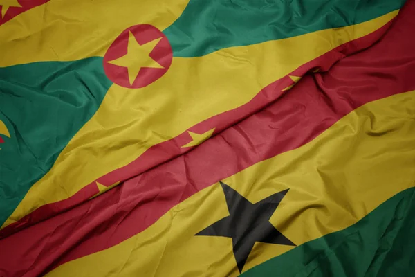 Gana 'nın renkli bayrağı ve Grenada' nın ulusal bayrağı sallanıyor.. — Stok fotoğraf