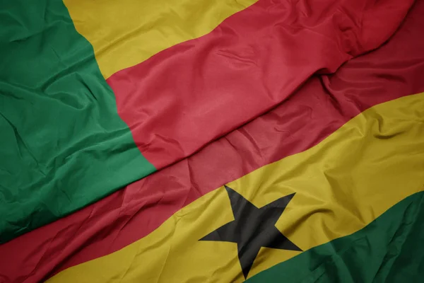 Waving colorful flag of ghana and national flag of benin. — Stock Photo, Image