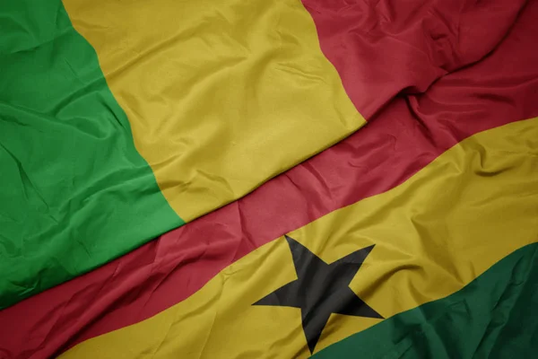 Waving colorful flag of ghana and national flag of mali. — Stock Photo, Image