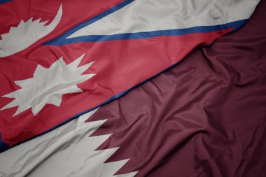Katar 'ın renkli bayrağı ve Nepal' in ulusal bayrağı sallanıyor..