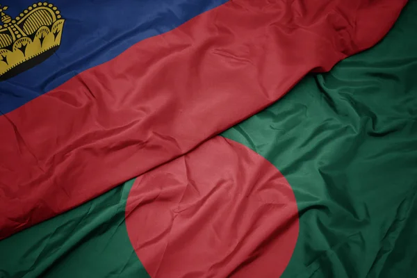 waving colorful flag of bangladesh and national flag of liechtenstein.