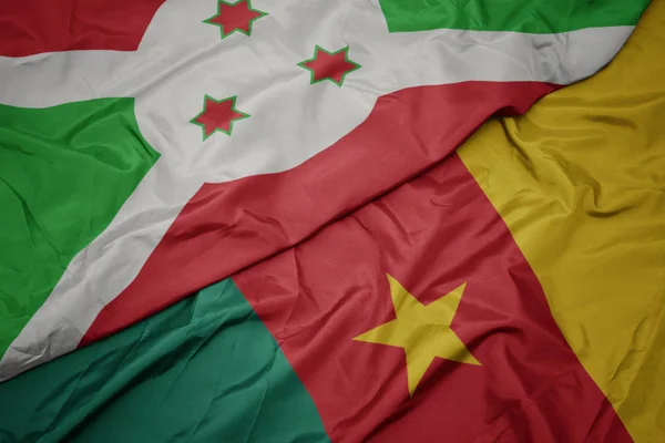 Ondeando colorida bandera de camerún y bandera nacional de burundi  . — Foto de Stock