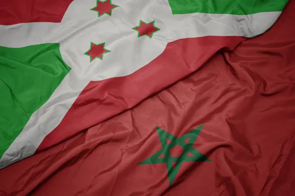モロッコのカラフルな旗とブルンジの国旗を振って . — ストック写真