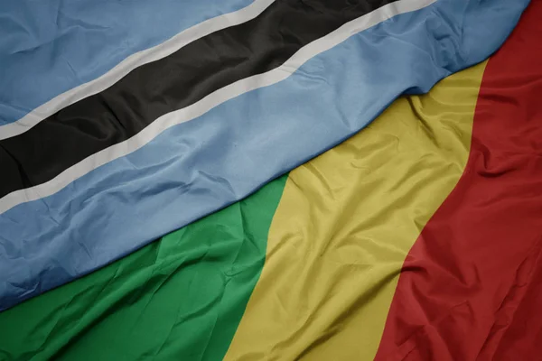 Acenando bandeira colorida da república do Congo e bandeira nacional do Botsuana . — Fotografia de Stock