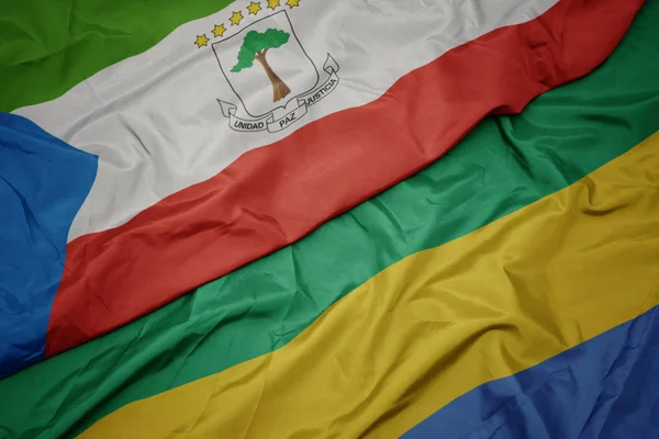 Ondeando colorida bandera de gabón y bandera nacional de Guinea Ecuatorial . —  Fotos de Stock