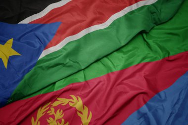 waving colorful flag of eritrea and national flag of south sudan.