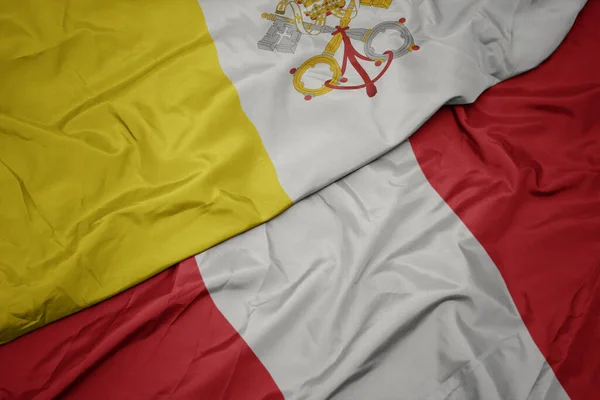 Waving colorful flag of peru and national flag of vatican city. — Stock Photo, Image