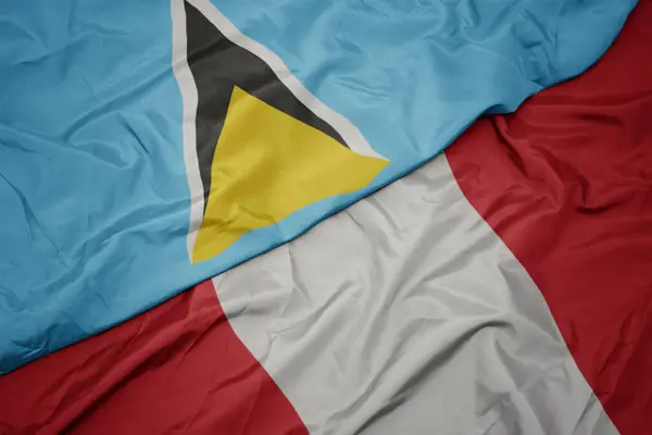 Waving colorful flag of peru and national flag of saint lucia. — Stock Photo, Image