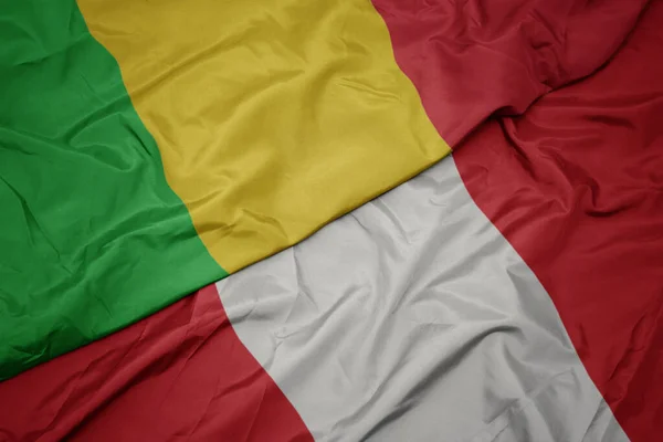 Waving colorful flag of peru and national flag of mali. — Stock Photo, Image