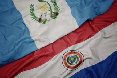 Paraguay 'ın renkli bayrağı ve Guatemala' nın ulusal bayrağı sallanıyor. makro