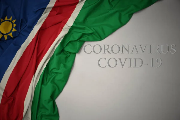 Ondeando Colorida Bandera Nacional Namibia Sobre Fondo Gris Con Texto — Foto de Stock