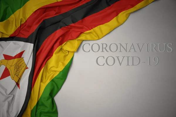 Ondeando Colorida Bandera Nacional Zimbabwe Sobre Fondo Gris Con Texto —  Fotos de Stock