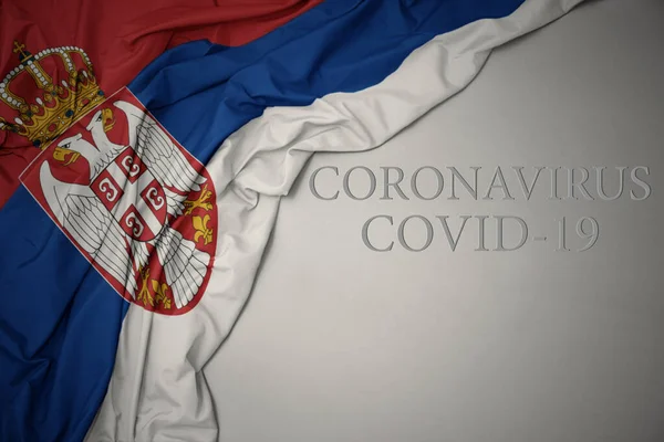 Ondeando Colorida Bandera Nacional Serbia Sobre Fondo Gris Con Texto —  Fotos de Stock