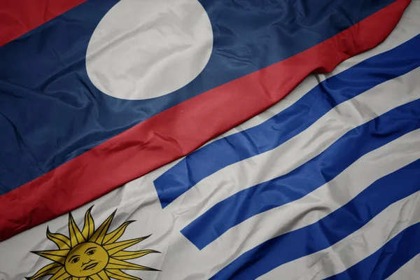 Acenando Bandeira Colorida Uruguai Bandeira Nacional Laos Macro — Fotografia de Stock