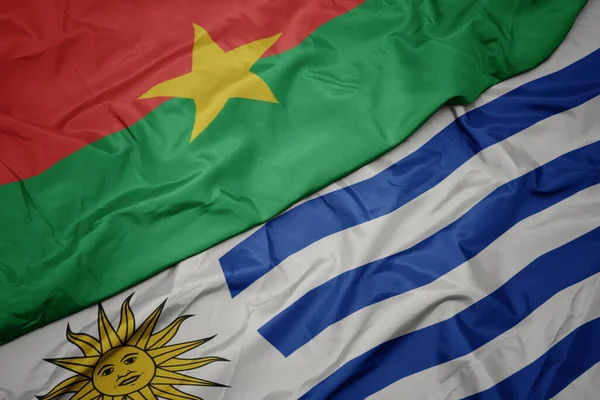 Vlající Barevnou Vlajkou Uruguaye Národní Vlajkou Burkiny Faso Makro — Stock fotografie
