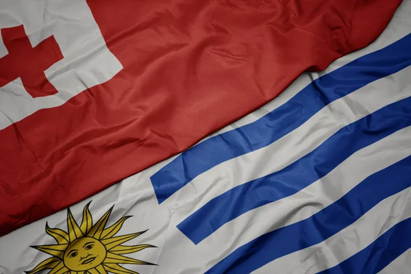 Színes Uruguay Zászlót Lobogtatva Tonga Nemzeti Zászlaját Lobogtatva Makroszintű — Stock Fotó