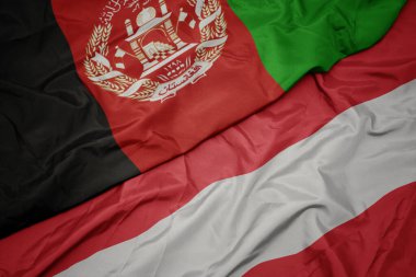 Avustralya 'nın renkli bayrağını ve Afganistan' ın ulusal bayrağını sallıyordu. makro