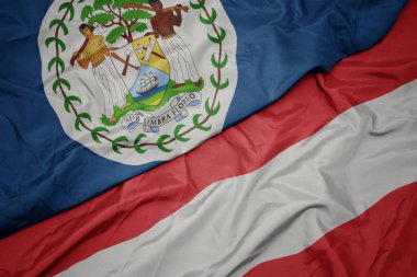 Austria 'nın renkli bayrağını ve Belize' nin ulusal bayrağını sallıyordu. makro