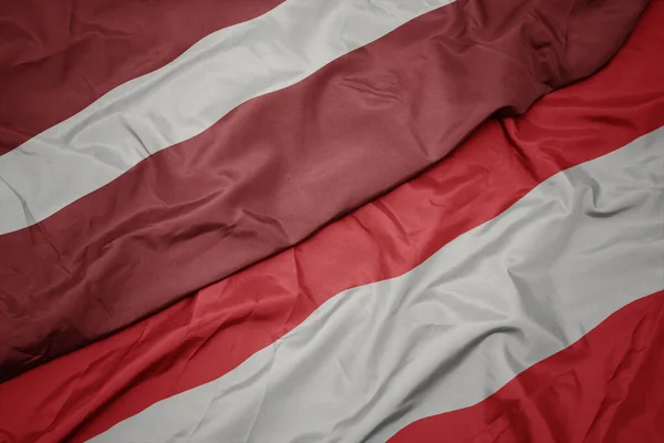 Ondeando Colorida Bandera Austria Bandera Nacional Latvia Macro — Foto de Stock