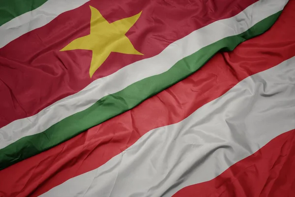 Waving Colorful Flag Austria National Flag Suriname Macro — Stock Photo, Image