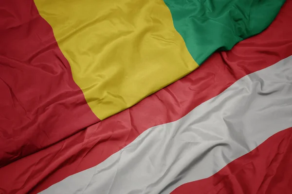 Waving Colorful Flag Austria National Flag Guinea Macro — Stock Photo, Image