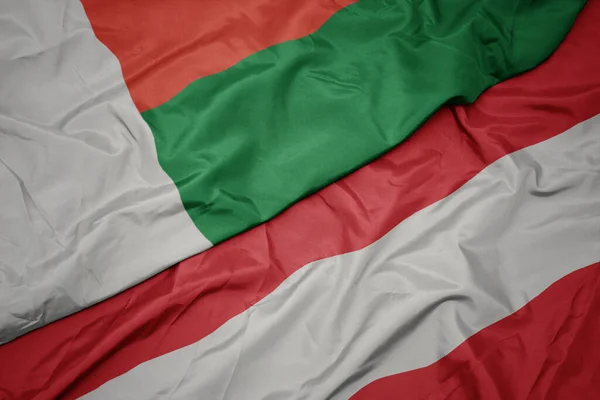 Ausztria Színes Zászlaját Lobogtatva Madagaszkár Nemzeti Zászlaját Lobogtatva Makroszintű — Stock Fotó