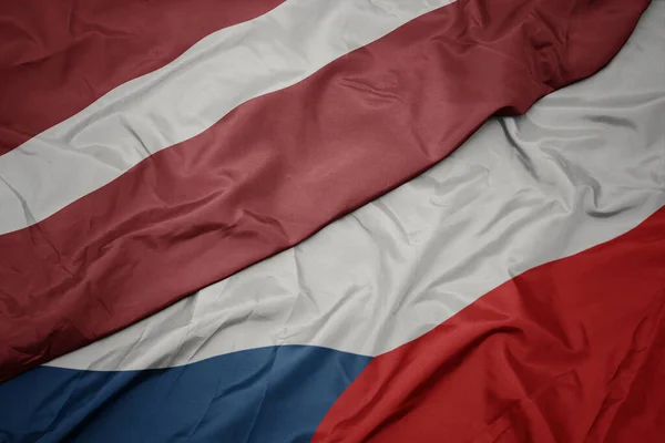 Zwaaiende Kleurrijke Vlag Van Tsjechische Republiek Nationale Vlag Van Latvia — Stockfoto