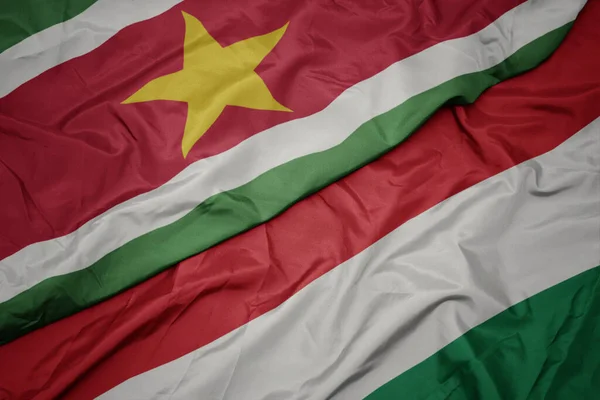 Ondeando Bandera Colorida Hungary Bandera Nacional Suriname Macro — Foto de Stock