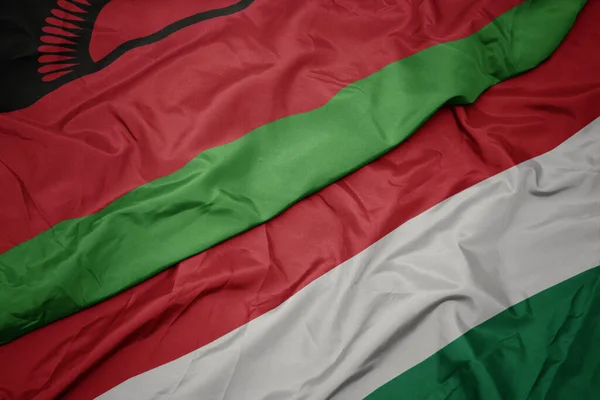 Waving Colorful Flag Hungary National Flag Malawi Macro — Stock Photo, Image