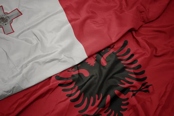 Albania Nın Renkli Bayrağı Malta Nın Ulusal Bayrağı Sallanıyor Makro — Stok fotoğraf