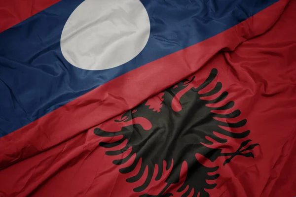 Waving Colorful Flag Albania National Flag Laos Macro — Stock Photo, Image
