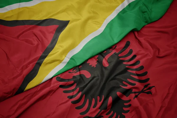 Waving Colorful Flag Albania National Flag Guyana Macro — Stock Photo, Image