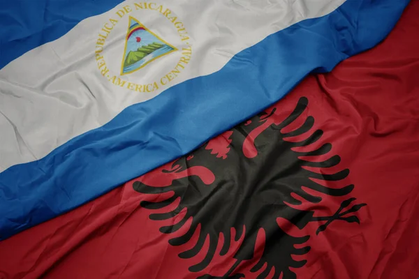 Albania Nın Renkli Bayrağı Nikaragua Nın Ulusal Bayrağı Sallanıyor Makro — Stok fotoğraf