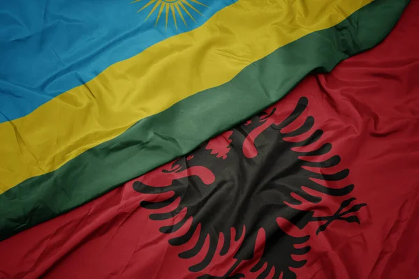 Waving Colorful Flag Albania National Flag Rwanda Macro — Stock Photo, Image