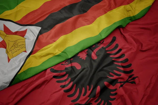 Waving Colorful Flag Albania National Flag Zimbabwe Macro — Stock Photo, Image