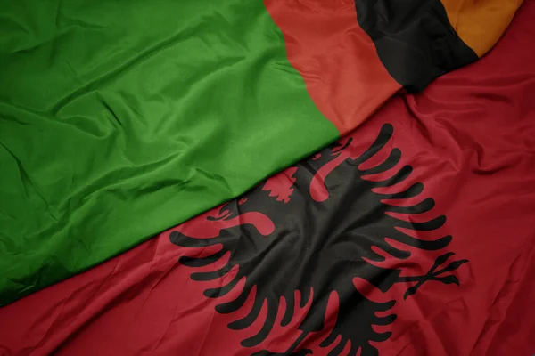 Albania Nın Renkli Bayrağı Zambiya Nın Ulusal Bayrağı Sallanıyor Makro — Stok fotoğraf