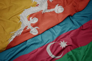Azerbaijan 'ın renkli bayrağı ve Bhutan' ın ulusal bayrağı sallanıyor. makro
