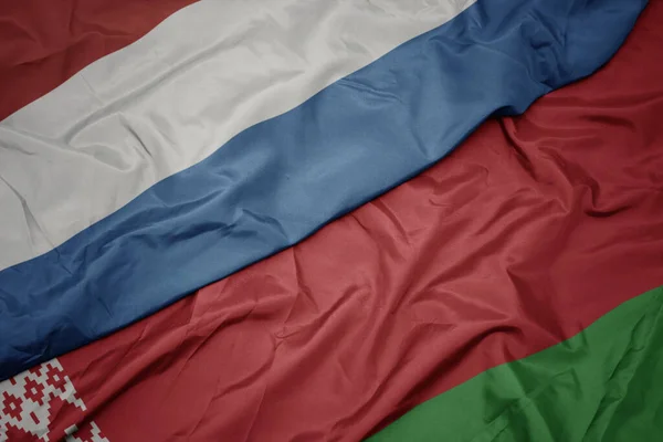 Mává Barevnou Vlajkou Běloruska Státní Vlajkou Luxembourgu Makro — Stock fotografie